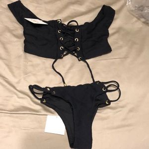 Bikini with tie front and gold rings.